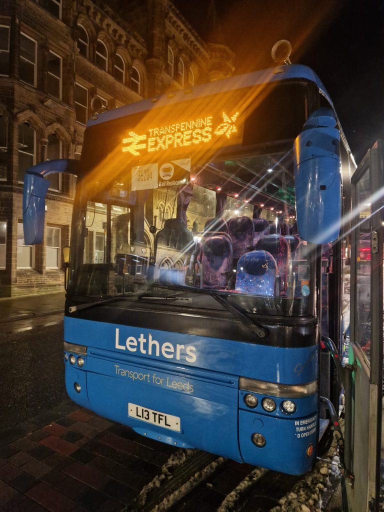 Lethers Travel coach on rail replacement duty in Leeds at night