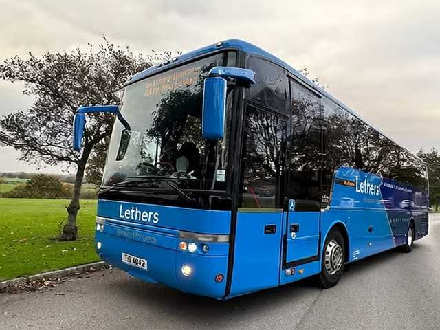 Blue Lethers Travel coach parked on a country road near Leeds